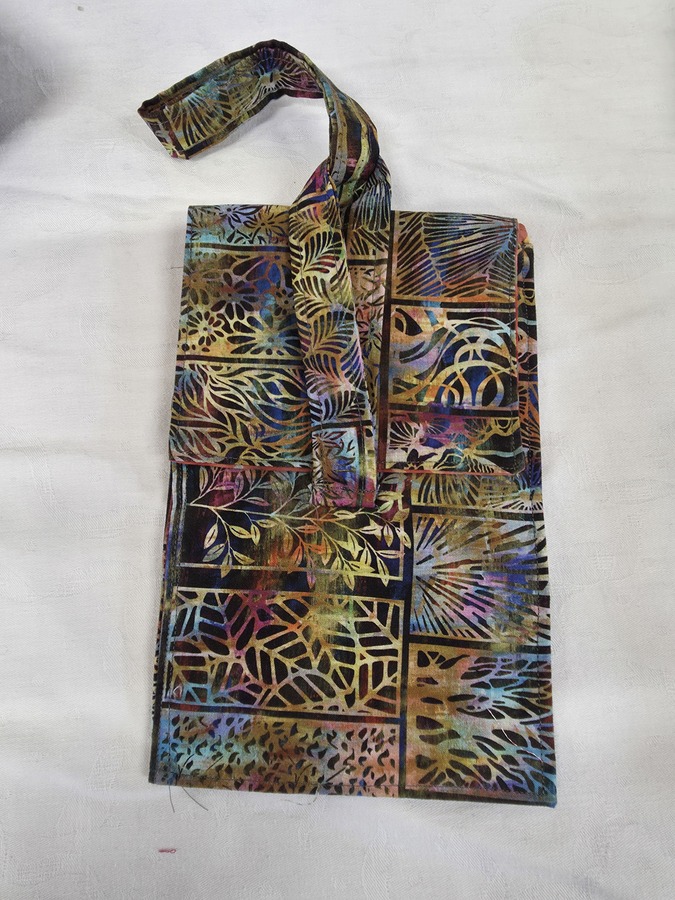 Jackie - travel bad with pockets for passport, phone etc